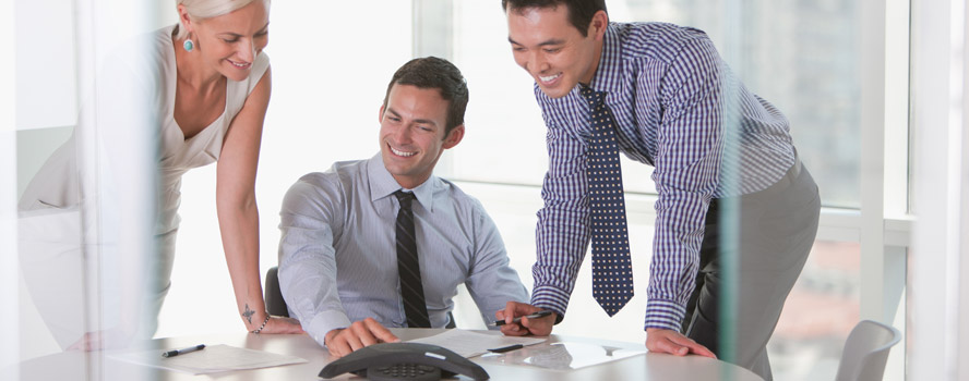 three coworkers collaborating on a project
